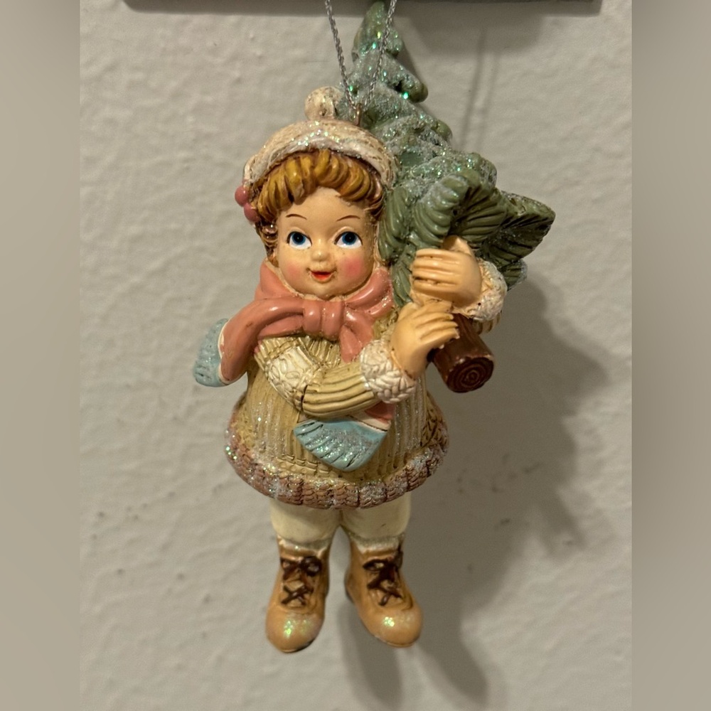 Christmas tree decoration. Boy with a Christmas tree. In pastel colors,